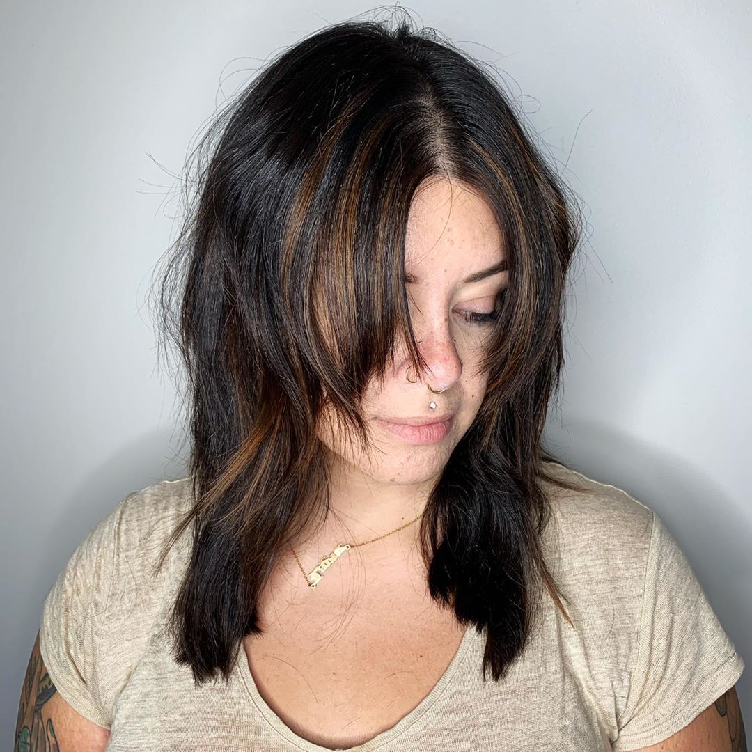 Medium Layered Haircut with Long Bangs