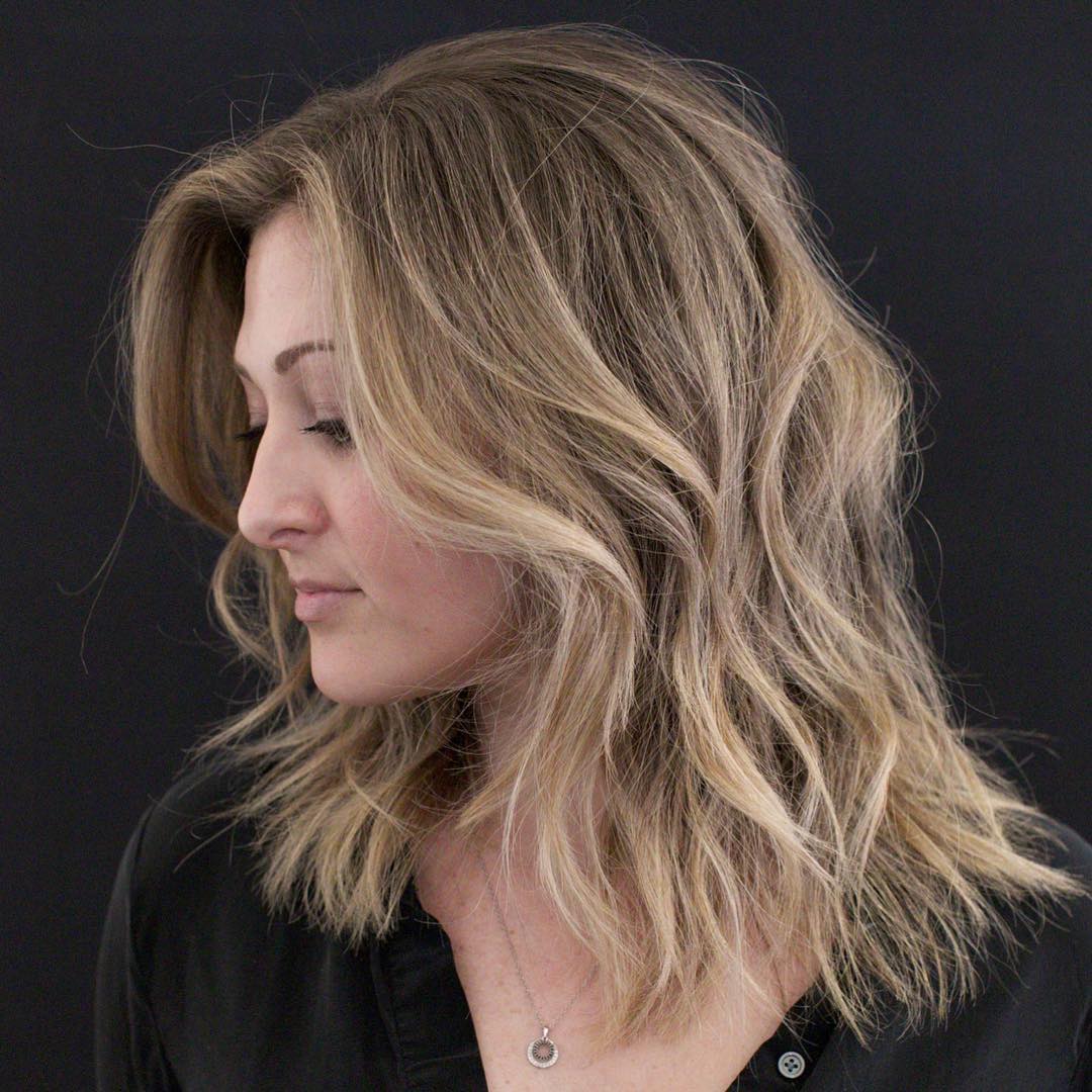 Medium Shaggy Hairstyle with Bangs