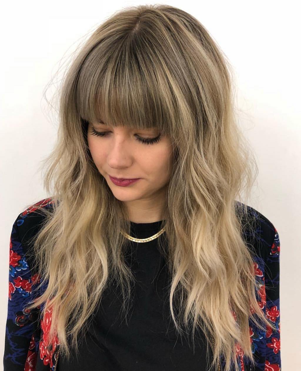 Long Layered Hairstyle With A Blunt Fringe